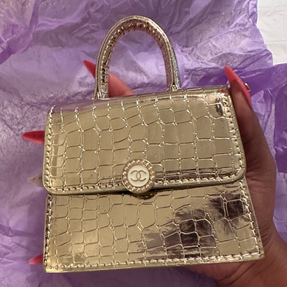 Authentic Chanel button added to micro crossbody bag